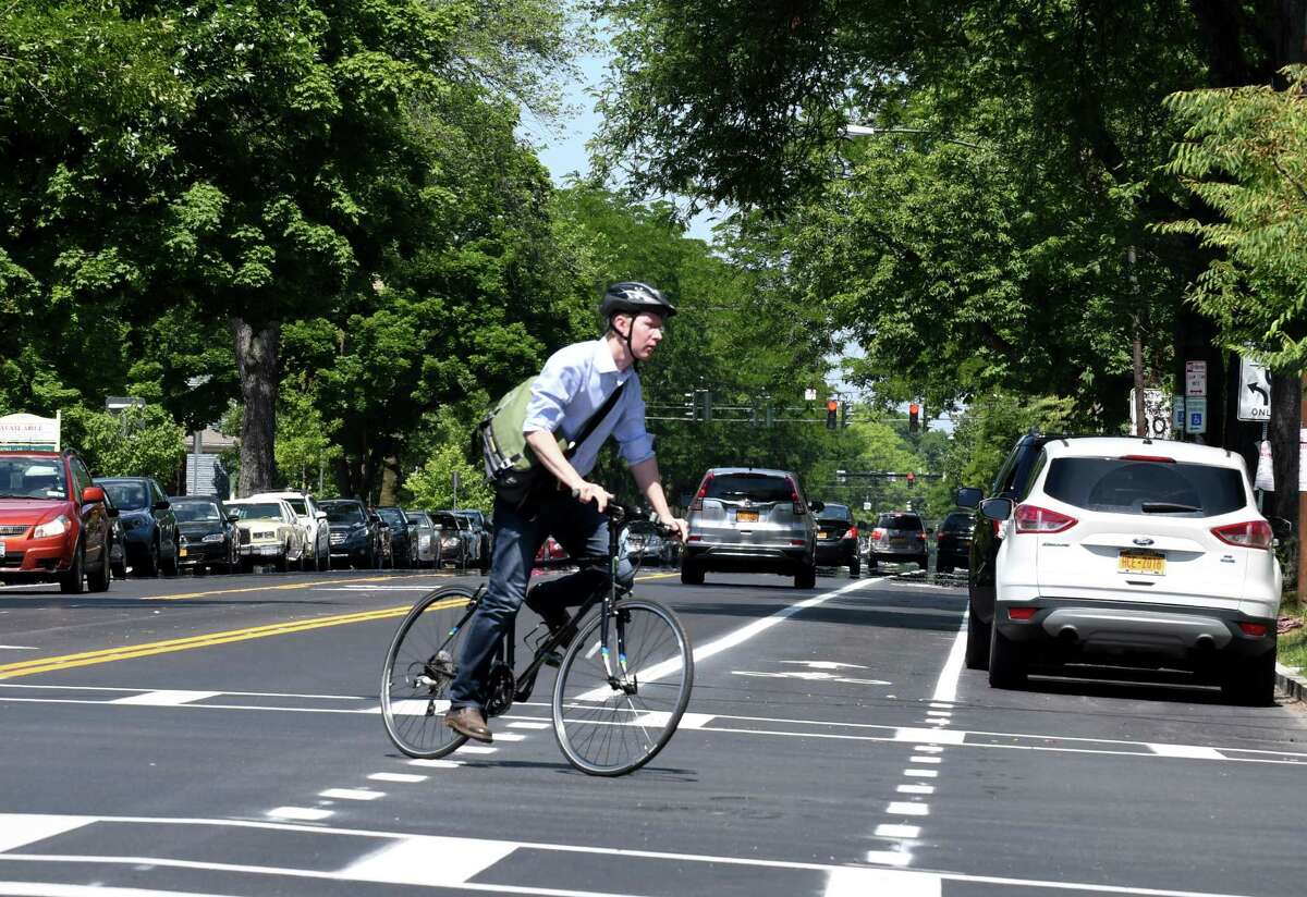 A cyclist crosses Madison Ave. at S. Lake on Friday, June 29, 2018, in Albany, N.Y. Mayor Kathy Sheehan held a press conference to highlight the completion of the major components of the second and final phase of the Madison Avenue Street Calming project. (Will Waldron/Times Union)