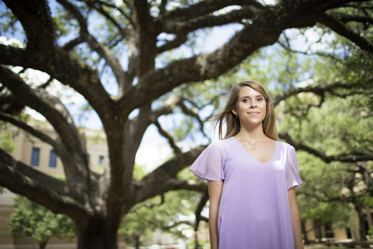 Texas A&M University student Nicole Platamone stands under the Century Tree, Thursday, June 28, 2018, in Houston.