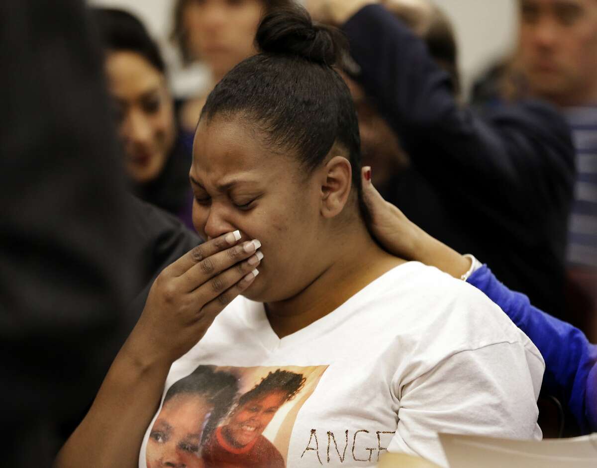 FILE - In this Dec. 20, 2013 file photo, Nailah Winkfield, mother of 13-year-old Jahi McMath, cries before a courtroom hearing regarding McMath, in Oakland, Calif. New Jersey officials say McMath, the girl at the center of the medical and religious debate over brain death, has died from excessive bleeding. The girl's mother said Thursday, June 28, 2018, that New Jersey doctors declared Jahi McMath dead after an operation to treat an intestinal issue. A California coroner in 2013 ruled the then 13-year-old died after suffering irreversible brain damage during an operation to remove her tonsils. Her family did not accept the decision and opted to move her to New Jersey. (AP Photo/Ben Margot, file)