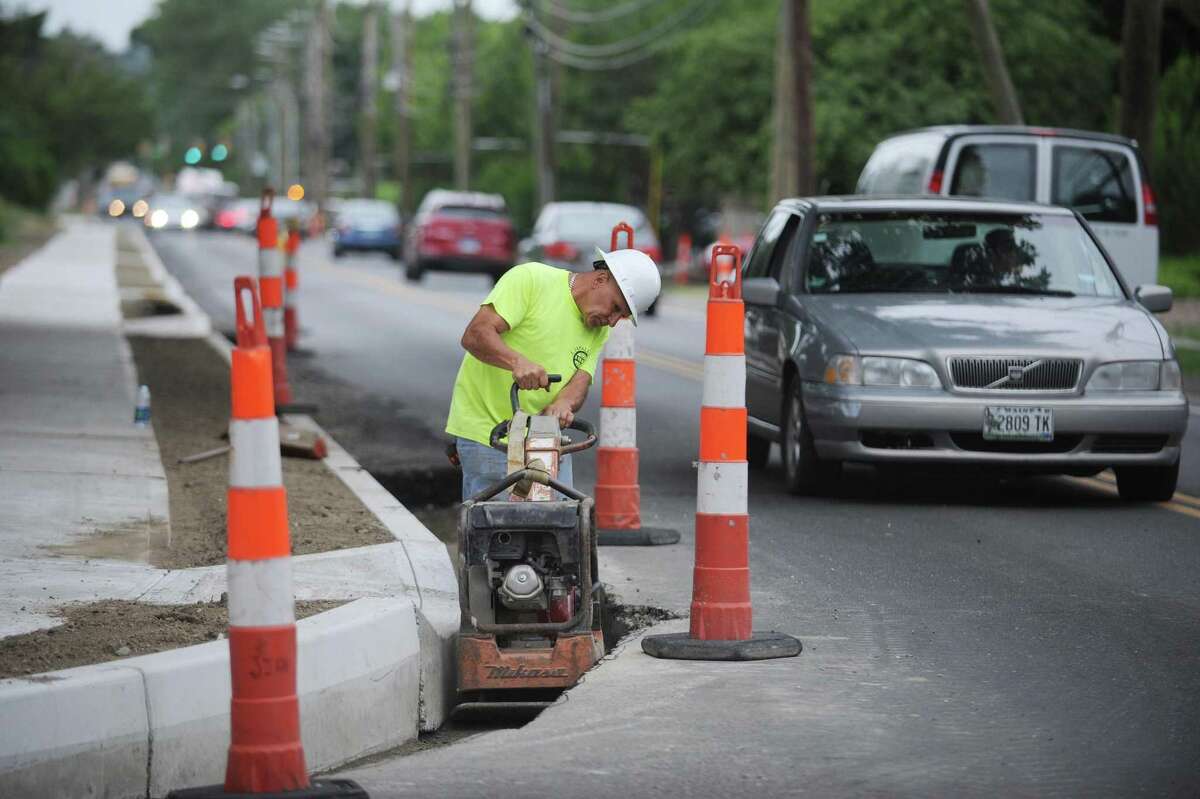 Connecticut Department of Transit employees work on widening Courtland Avenue in Stamford.