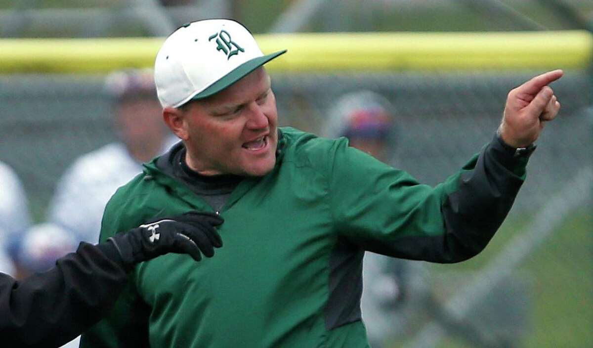 Reagan's head coach Chans Chapman argues a call from the District 26-6A high school baseball game between Madison and Reagan on Friday, April 20 ,2018 at Blossom Athletic Center.