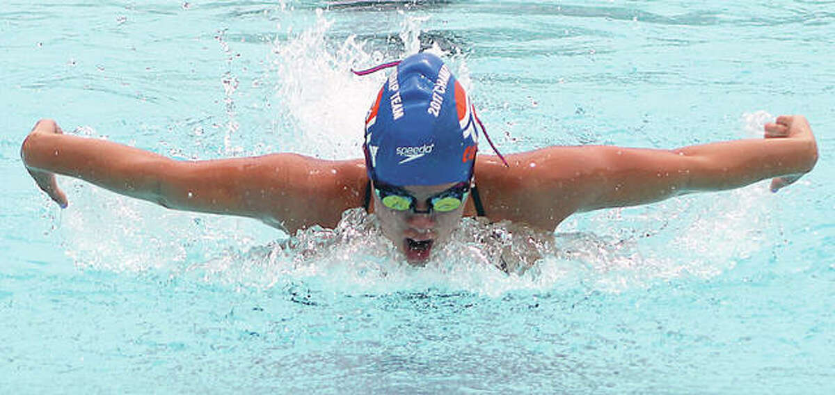 Ginny Schranck, a Marquette Catholic High grad, swims the butterfly portion of the Girls Open Individual Medley at the Clayton Shaw Park Summer Invitational last weekend.