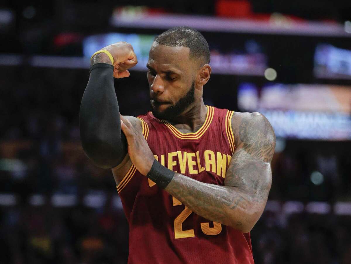 FLE - In this March 19, 2017, file photo, Cleveland Cavaliers' LeBron James flexes his arm after making a basket and drawing a foul call against the Los Angeles Lakers during the second half of an NBA basketball game in Los Angeles. The superstar declined his $35.6 million contract option on Friday, June 29, 2018, with Cleveland and will become a free agent. The four-time MVP could re-sign with his hometown Cavaliers, or go in a completely direction. What he decides in the next few days could re-shape the NBA landscape. (AP Photo/Jae C. Hong, File)