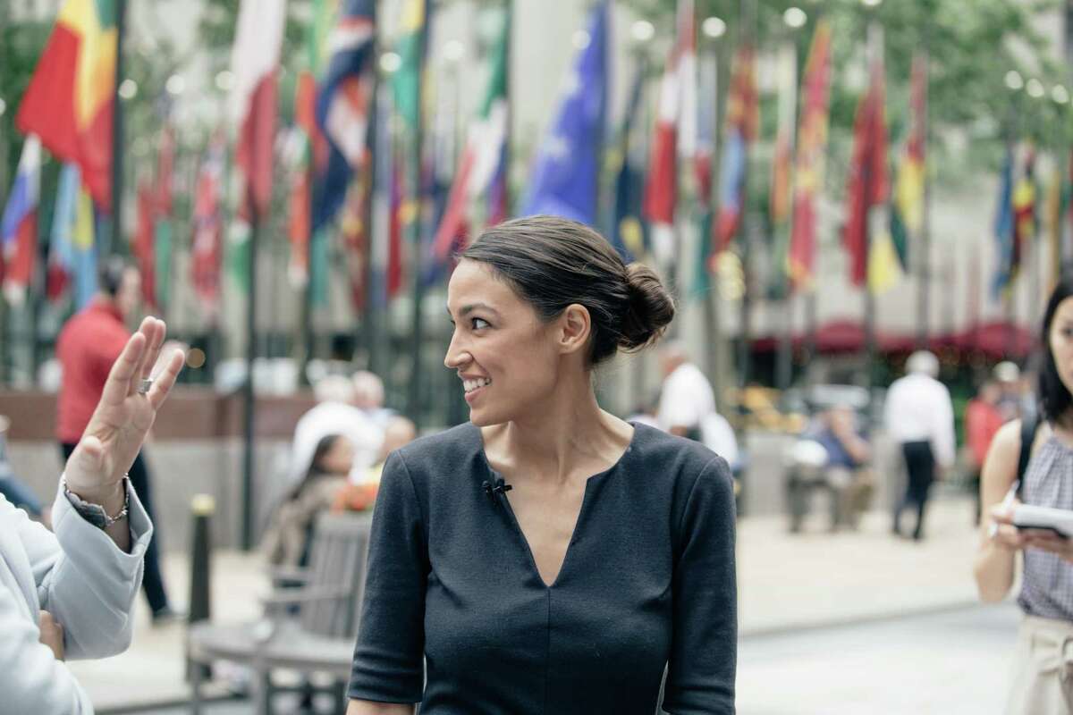 Alexandria Ocasio-Cortez, a political newcomer, talks to reporters in New York, June 27, 2018. Ocasio-Cortez unseated Rep. Joseph Crowley, a 20-year incumbent, in a blow to the Democratic party?’s traditional leaders. (Annie Tritt/The New York Times)