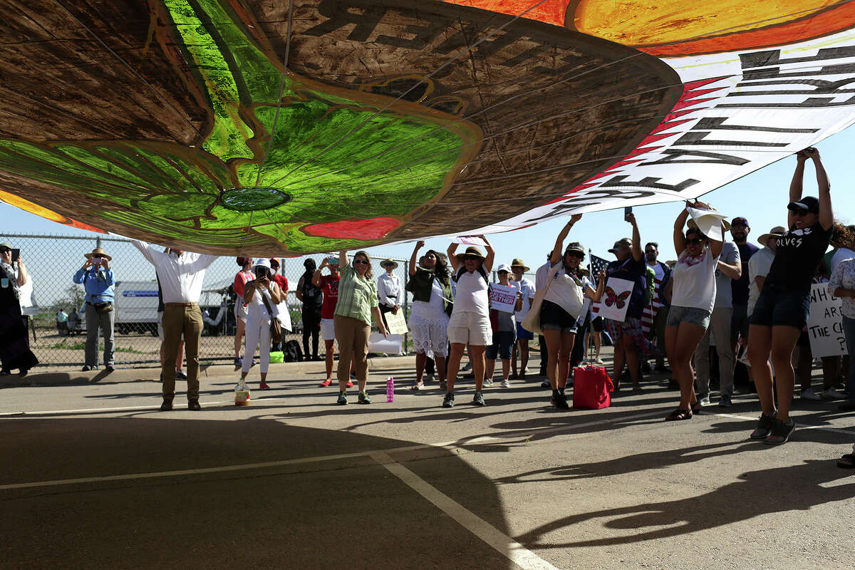 Participants take part in the Voto Latino StopSeparation.org rally outside the "tent city," for immigrant children separated from their parents after crossing illegally into the U.S. or seeking asylum, at the Marcelino Serna Port of Entry in Tornillo on June 24, 2018.