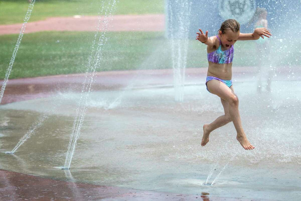 Shiela Gunderson, 7, of Lake George tries her dance steps in the spray pool at the Lake Avenue playground Monday July 2, 2018 in Saratoga Springs, N.Y. (Skip Dickstein/Times Union)