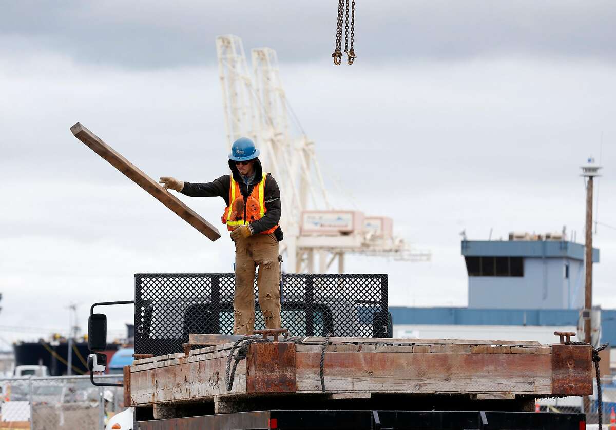 A construction crew works on a new ferry terminal near the old Ford assembly plant and Craneway Pavilion in Richmond, Calif. on Tuesday, May 15, 2018. The terminal is expected to boost the number of commuters and visitors to the area when ferry service begins in the fall.