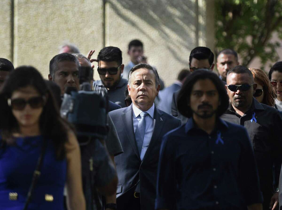 Former state Sen. Carlos Uresti’s Helotes estate was pulled from Tuesday’s foreclosure auction. Uresti is shown in June leaving the San Antonio federal courthouse surrounded by a crowd of supporters after being sentenced in the FourWinds Logistics fraud case.