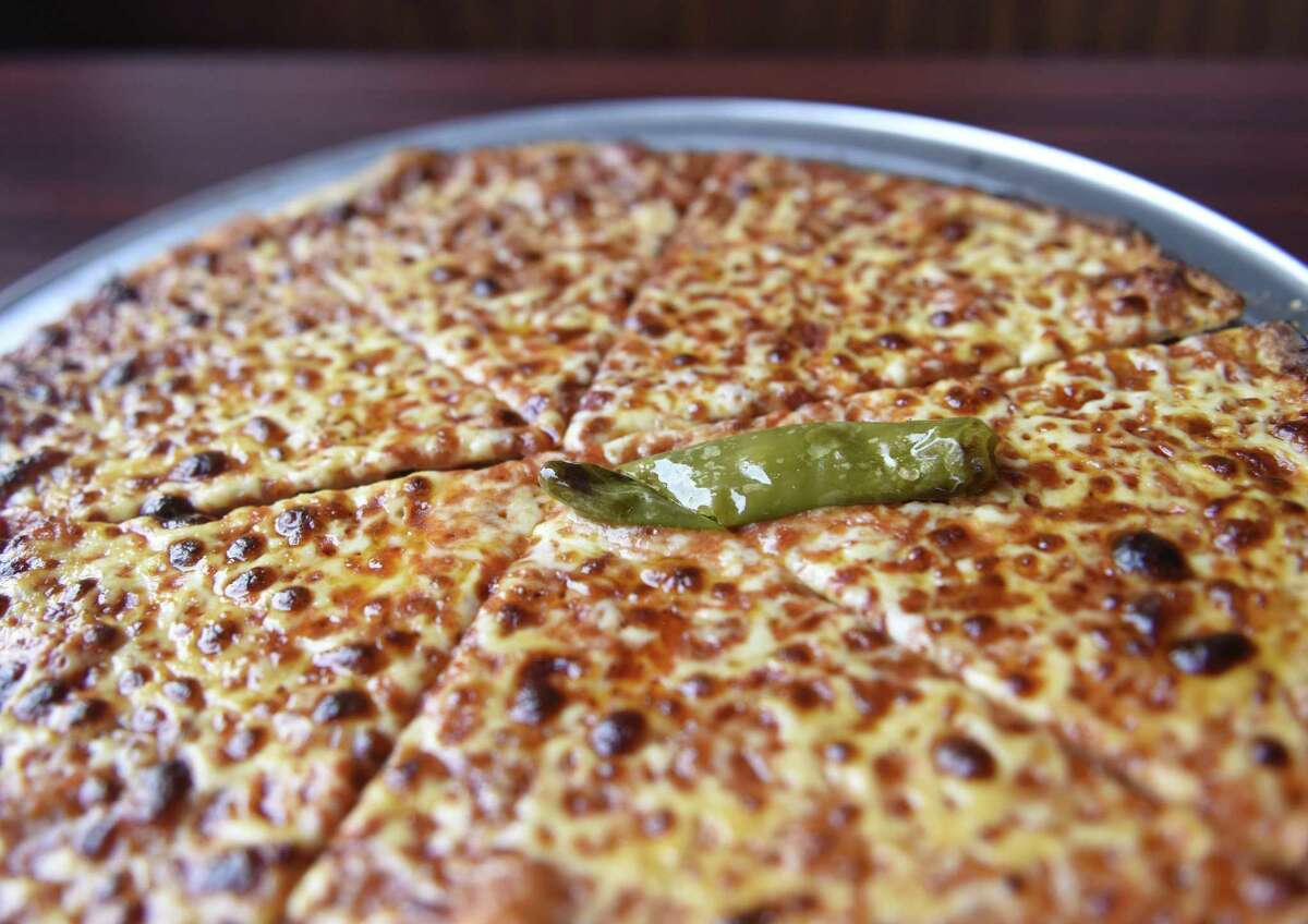 A popular hot oil pizza is served at Colony Grill in Port Chester, N.Y.