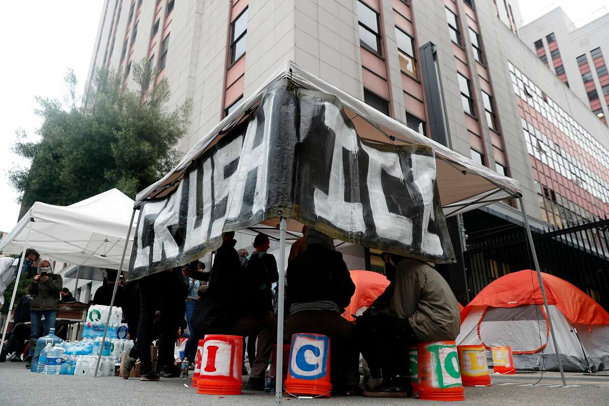 Several dozen Occupy protesters set up a camp outside the U.S. Citizenship and Immigration Services building to block Immigration and Customs Enforcement agents' access in San Francisco, Calif., on Monday, July 2, 2018.