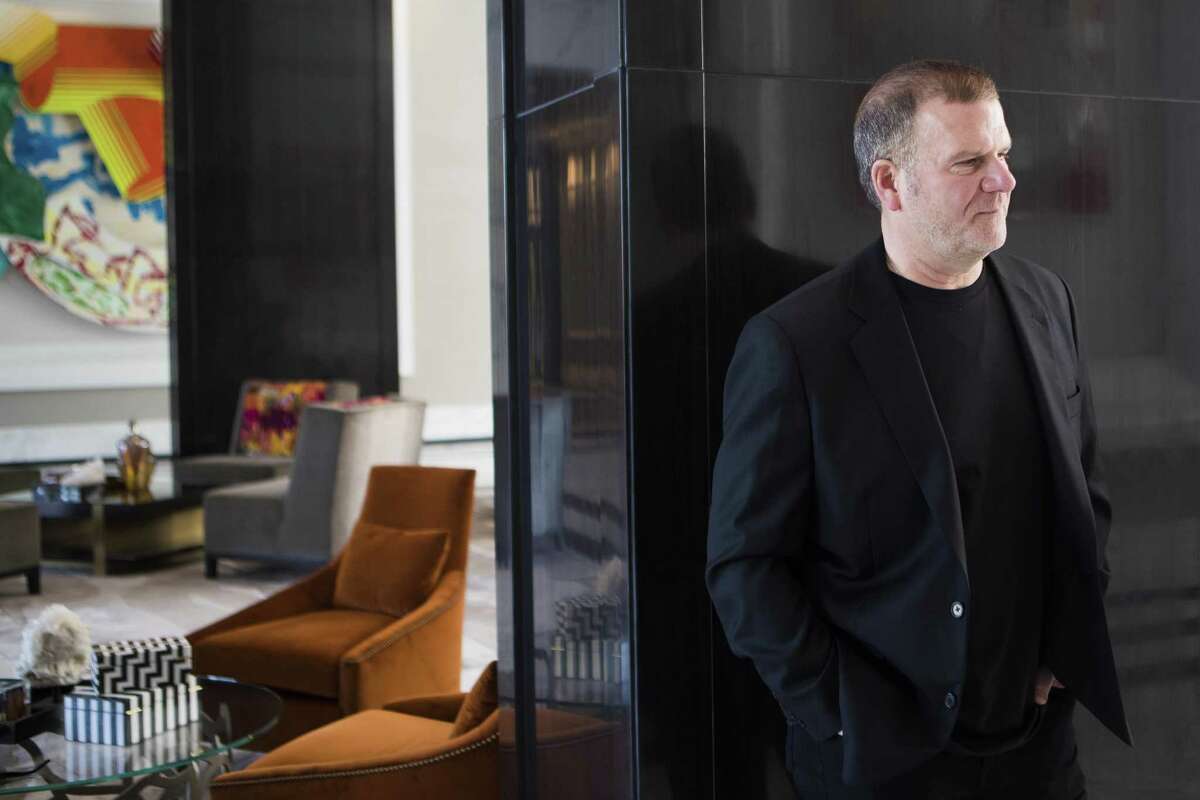 Landry's Inc. CEO Tilman Fertitta takes a look at the framing possibilities for the artwork located on the lobby of The Post Oak Hotel, Wednesday, March 14, 2018, in Houston. ( Marie D. De Jesus / Houston Chronicle )