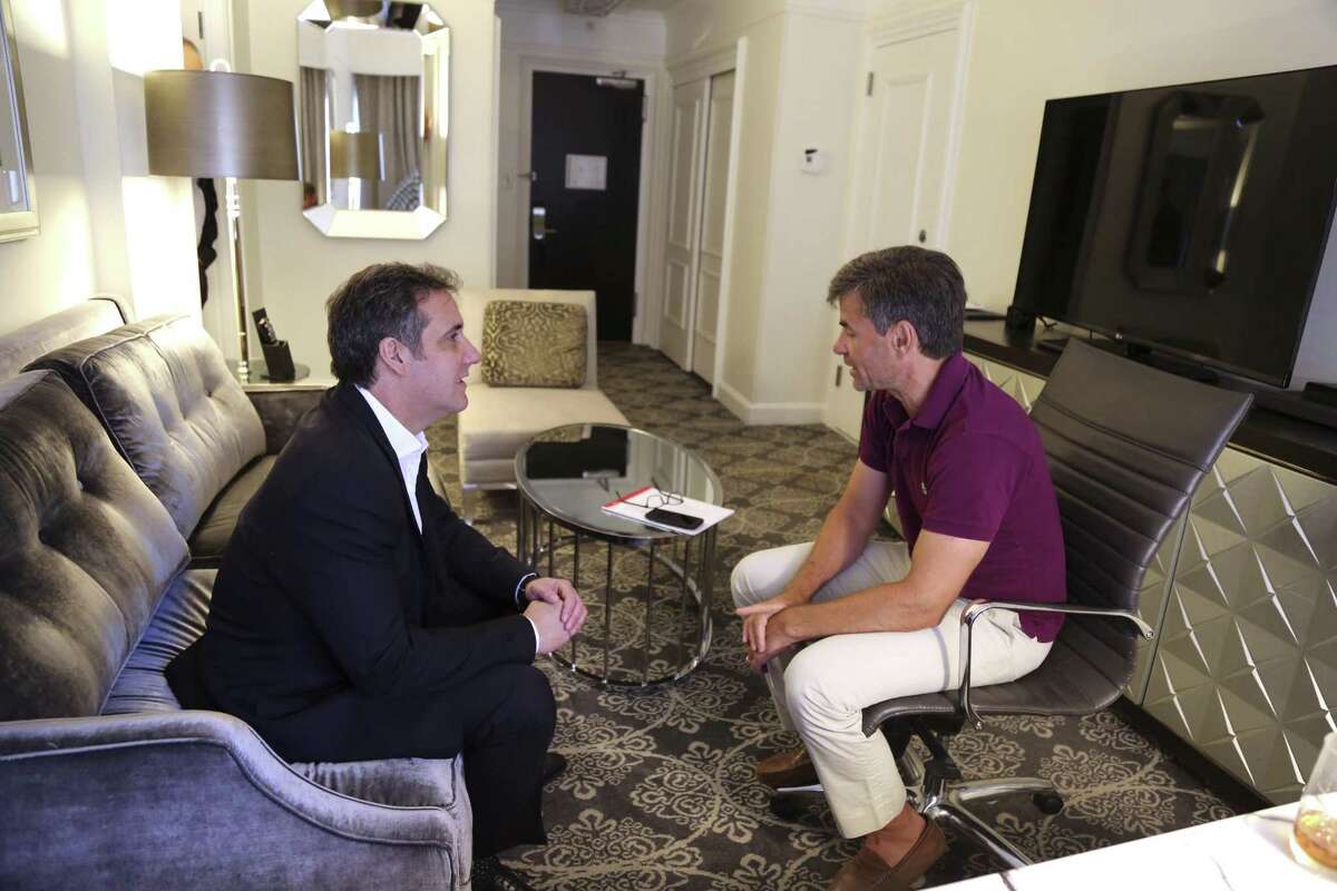 In this June 30, 2018, photo provided by ABC News, Michael Cohen, left, President Donald Trump's longtime personal lawyer and fixer, is interviewed by ABC's George Stephanopoulos during an off-camera interview in New York at the hotel where Cohen has been staying. In his first interview since federal agents raided his home and hotel room three months earlier as part of an investigation into his business dealings, Cohen made clear that protecting Trump is not his priority. "My wife, my daughter and my son have my first loyalty and always will," Cohen told Stephanopoulos, ''I put family and country first." (ABC News via AP)