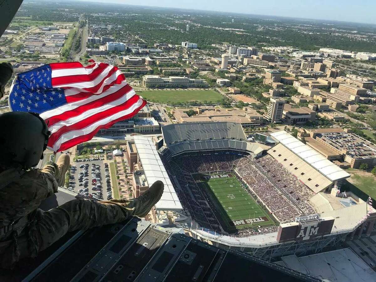 United States flags fly in center field before a baseball game