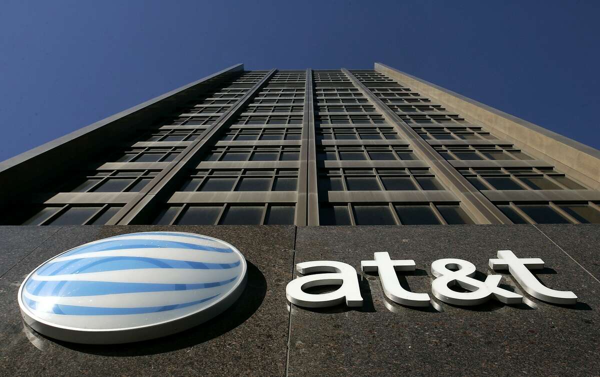 FILE - In this Jan. 25, 2007 file photo, the AT&T Michigan headquarters is shown in Detroit. AT&T Inc. on Sunday, March 20, 2011 said it will buy T-Mobile USA from Deutsche Telekom AG in a cash-and-stock deal valued at $39 billion, becoming the largest cellphone company in the U.S. (AP Photo/Paul Sancya, File)
