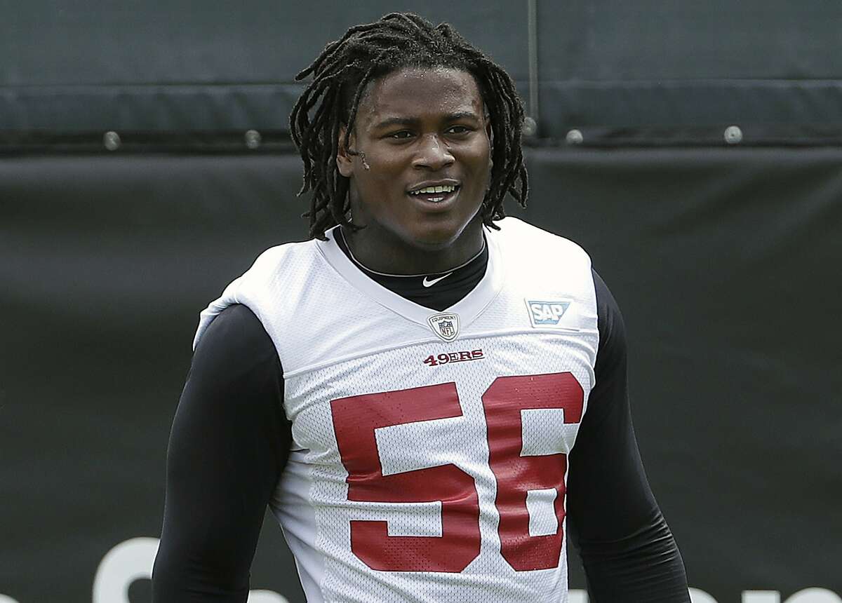 FILE - In this May 30, 2018, file photo, San Francisco 49ers linebacker Reuben Foster walks on the field during a practice at the team's NFL football training facility in Santa Clara, Calif. 49ers linebacker Reuben Foster has been suspended without pay for the first two games of the regular season for violating the NFL's conduct and substance abuse policy. The NFL said Tuesday, July 3, 2018, that Foster will also be fined for violations from a weapons offense and misdemeanor drug charge that were resolved earlier this offseason.