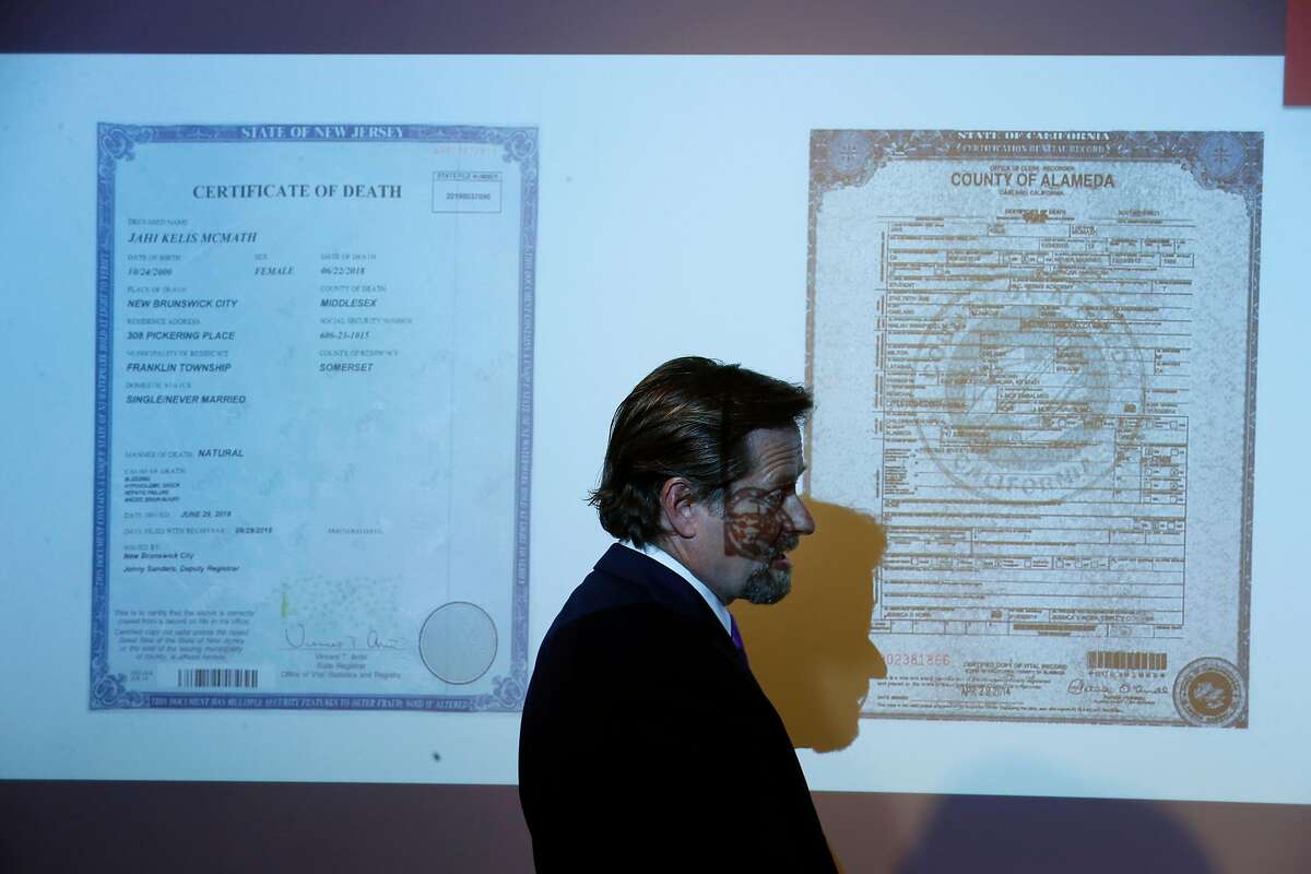 Attorney Christopher Dolan displays images of death certificates issued by New Jersey and California for Jahi McMath at a news conference in San Francisco, Calif. on Tuesday, July 3, 2018.