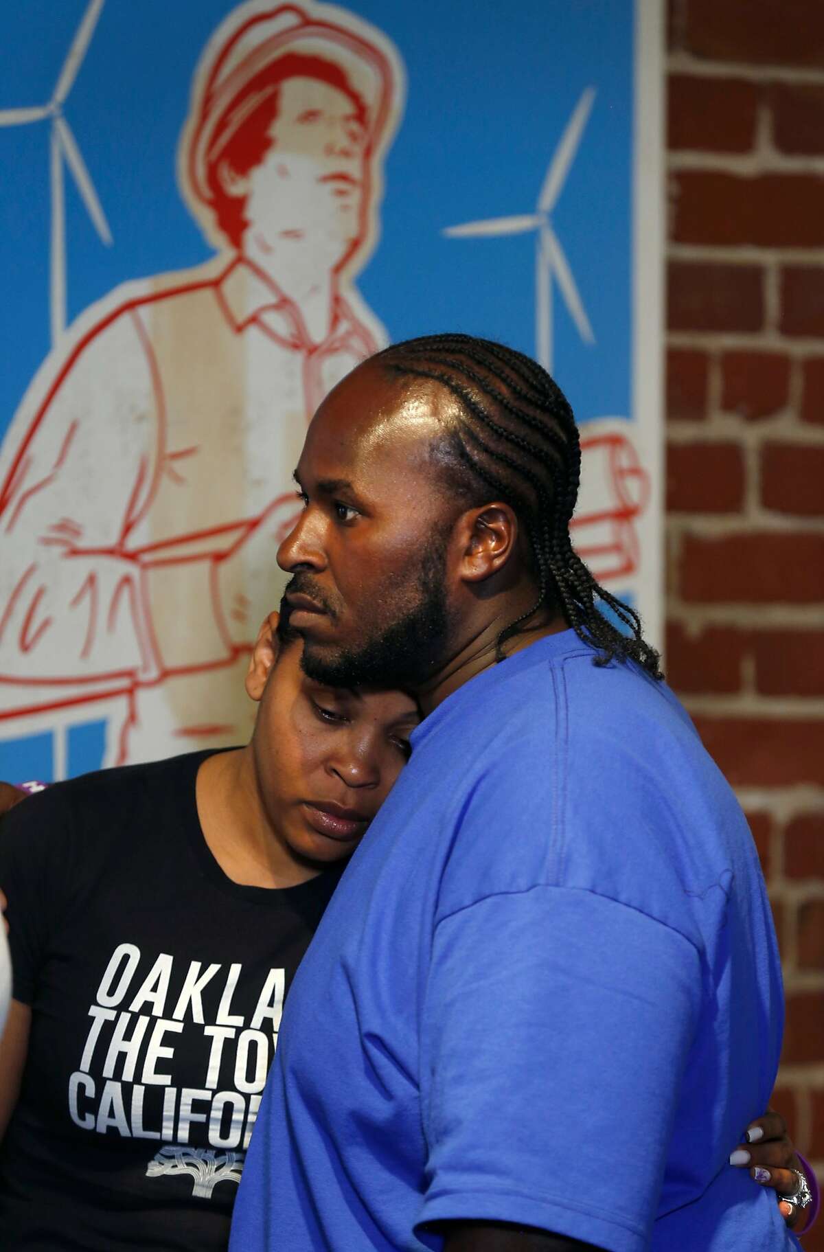 Marvin Winkfield hugs his wife Nailah Winkfield during a news conference to discuss the death of Nailah�s daughter Jahi McMath in San Francisco, Calif. on Tuesday, July 3, 2018.
