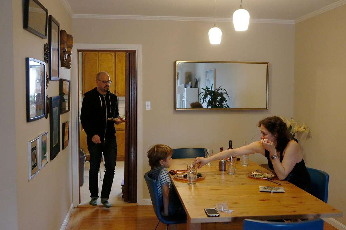 Adam West, Lauren West, and son Jackson West, 7, eat dinner at their home on Monday, July 2, 2018 in San Francisco, Calif. In November the West family purchased their first home in San Francisco thanks to a down payment loan assistance program that gives qualifying buyers an interest-free loan up to $375k.