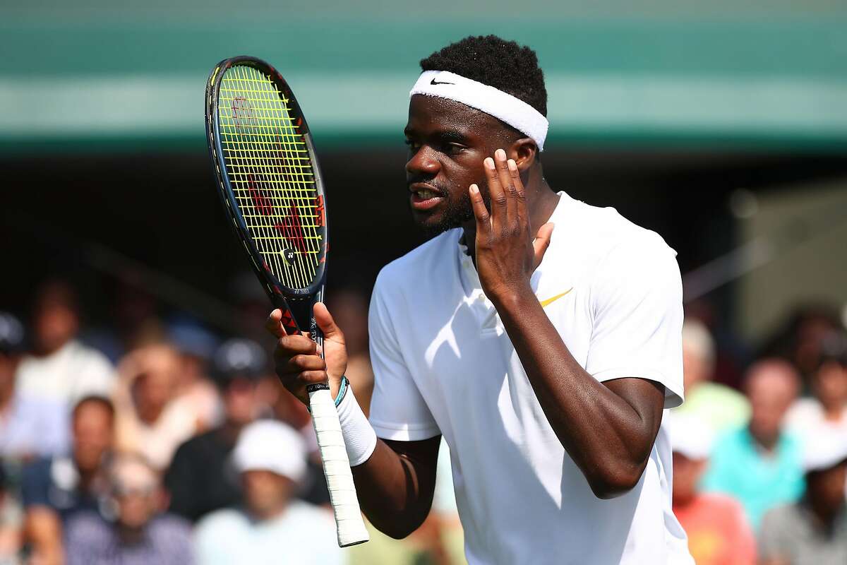 LONDON, ENGLAND - JULY 03: Frances Tiafoe of the United States reacts during his Men's Singles first round match against Fernando Verdasco of Spain on day two of the Wimbledon Lawn Tennis Championships at All England Lawn Tennis and Croquet Club on July 3, 2018 in London, England. (Photo by Clive Brunskill/Getty Images)