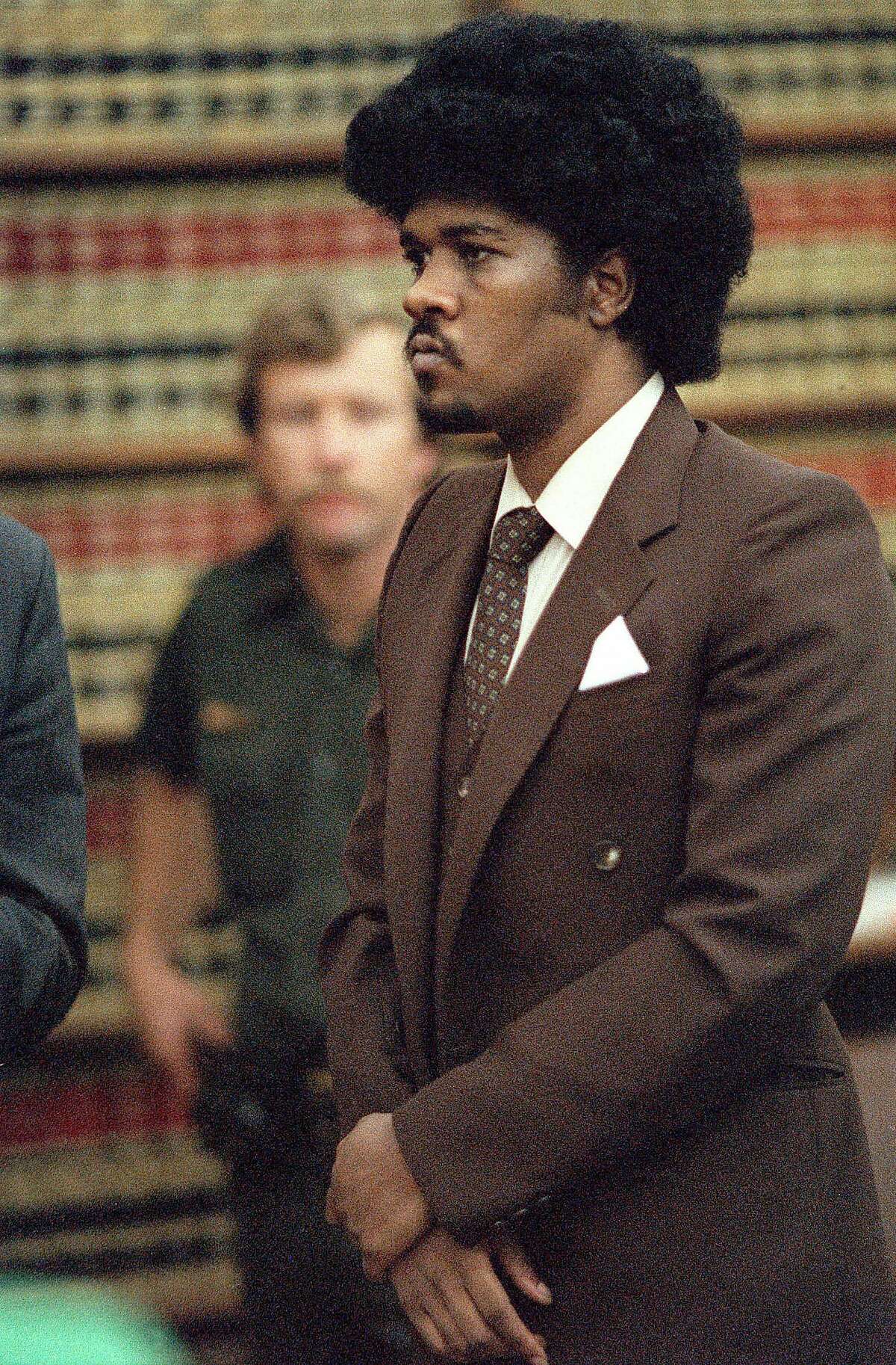 **FOR USE AS DESIRED WITH COOPER EXECUTION STORIES-FILE ** Convicted murder Kevin Cooper stands before a San Diego judge in this May 1985 file photo when he was sentenced to death for the 1983 slayings of three Chino Hills, Calif, family members and a friend. Cooper is scheduled to die by lethal injection Tuesday, Feb. 10 in California's San Quentin prison. (AP Photo/San Diego Union Tribune, Dave Siccardi, File) Kevin Cooper, sentenced to die 12:01 a.m. Tuesday, was convicted of murdering four people in 1983. Ran on: 12-13-2010 Kevin Cooper during his sentencing hearing in 1985.