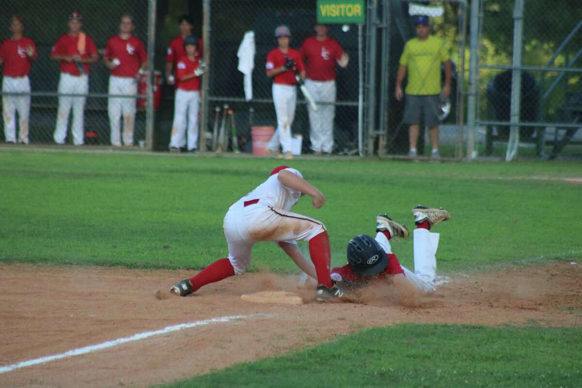League City White third baseman Alek Kowalczyk applies the tag on a League City Red runner during Game 1 action Monday night. In addition to Red's offense not driving in any runs, they had two players tagged out at third base, which proved costly in the one-run defeat.