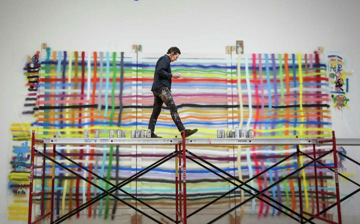 Alicia McCarthy, seen working on a piece on plexiglas for her 2017 exhibit at the San Francisco Museum of Modern Art, is joining with her longtime friend Ruby Neri for a new exhibit at Berkeley Art Museum and Pacific Film Archive. The two were members of the “Mission School” art scene in the 1990s.
