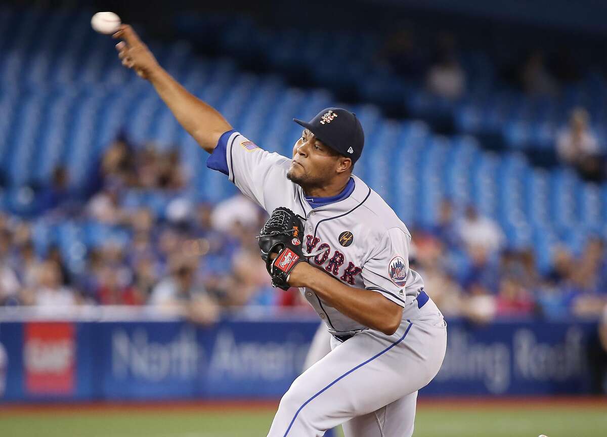 TORONTO, ON - JULY 4: Jeurys Familia #27 of the New York Mets delivers a pitch in the ninth inning during MLB game action against the Toronto Blue Jays at Rogers Centre on July 4, 2018 in Toronto, Canada. (Photo by Tom Szczerbowski/Getty Images)