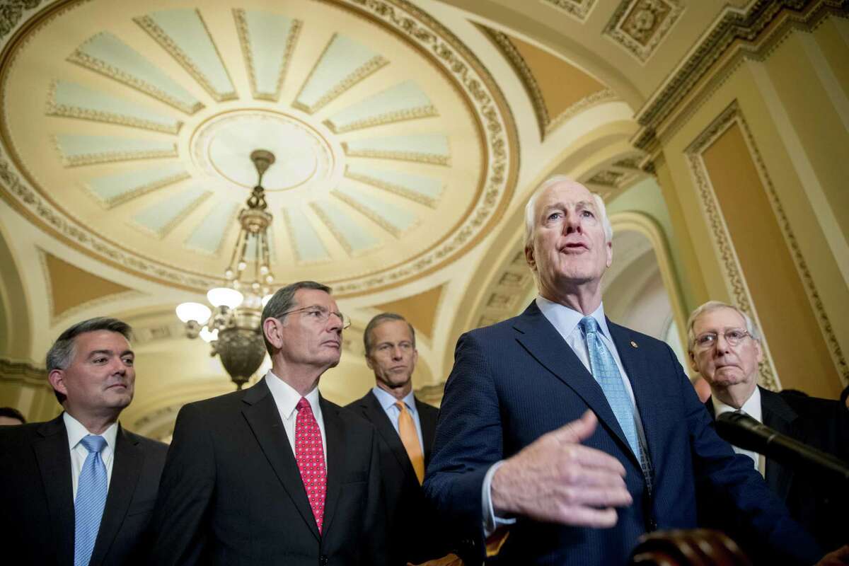 Senate Majority Whip Sen. John Cornyn, R-Texas., second from right, accompanied by from right, Sen. Cory Gardner, R-Colo., Sen. John Barrasso, R-Wyo., Sen. John Thune, R-S.D., and Senate Majority Leader Mitch McConnell of Ky., speaks with reporters following a closed door luncheon on Capitol Hill in Washington, Tuesday, June 26, 2018. (AP Photo/Andrew Harnik)