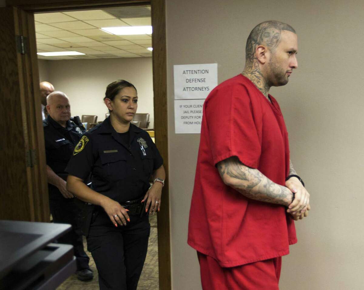 Capital murder suspect Brian Flores, right, leaves the courtroom Thursday, July 5, 2018 after a mistrial was declared in his case. Flores sought the mistrial on the grounds the lead defense attorney in the case, Ed Camara, was not capable of effectively defending Flores after Camara suffered a concussion from a fall.