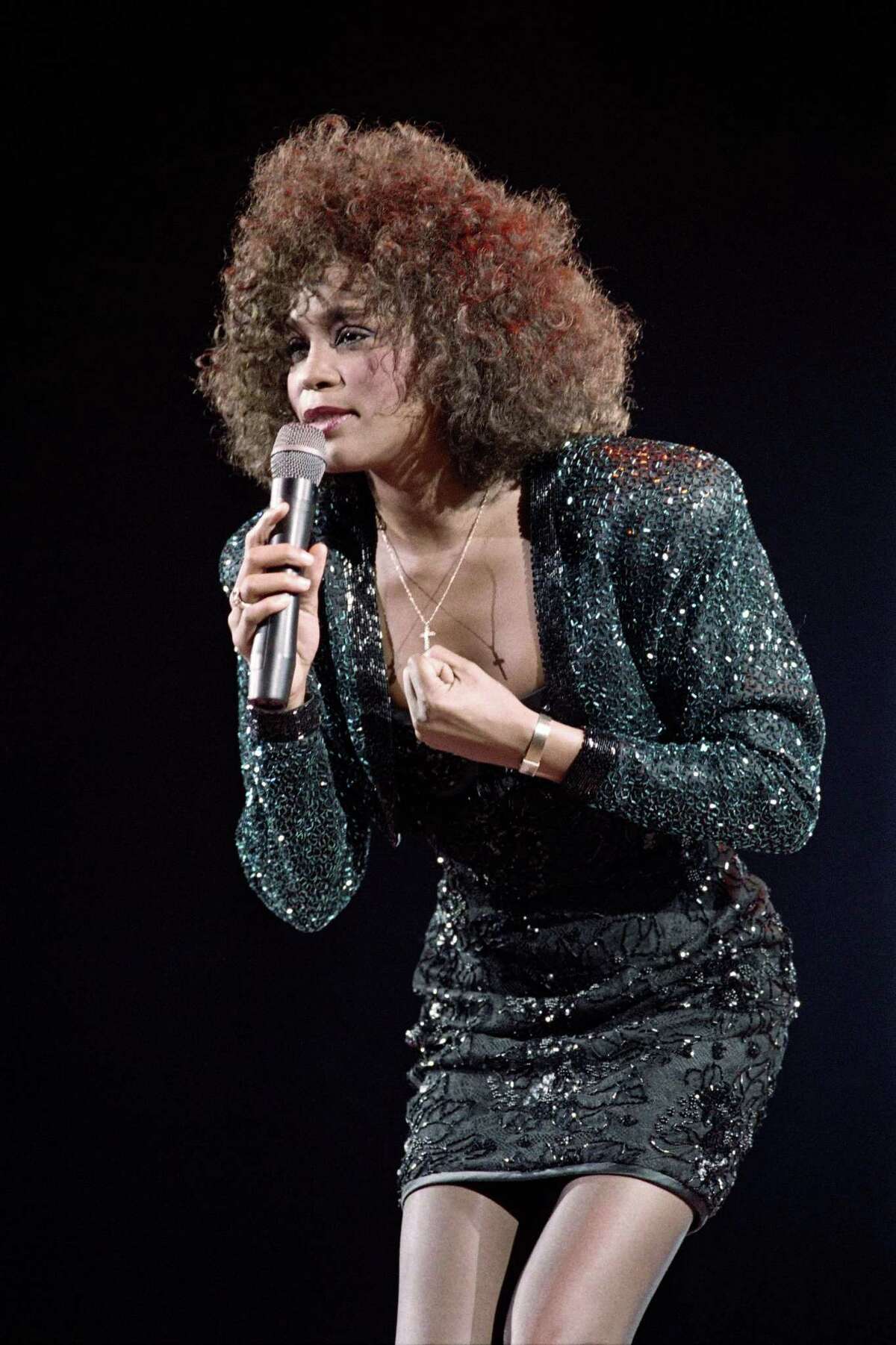(FILES) A file picture taken on May 18, 1988 in Paris shows US singer Whitney Houston performing at the POPB (Bercy hall). Grammy-winning pop legend and actress Whitney Houston, 48, was found dead on February 11, 2012 in a Beverly Hills hotel, police said. AFP PHOTO BERTRAND GUAY (Photo credit should read BERTRAND GUAY/AFP/Getty Images)