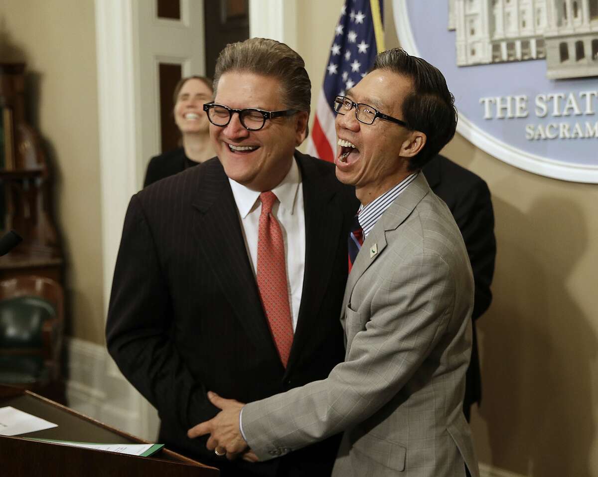 State Sen. Robert Hertzberg, D-Van Nuys (left), and Assembly Member Ed Chau, D-Monterey Park (Los Angeles County), celebrate after their data privacy bill was approved by the Legislature in 2018.