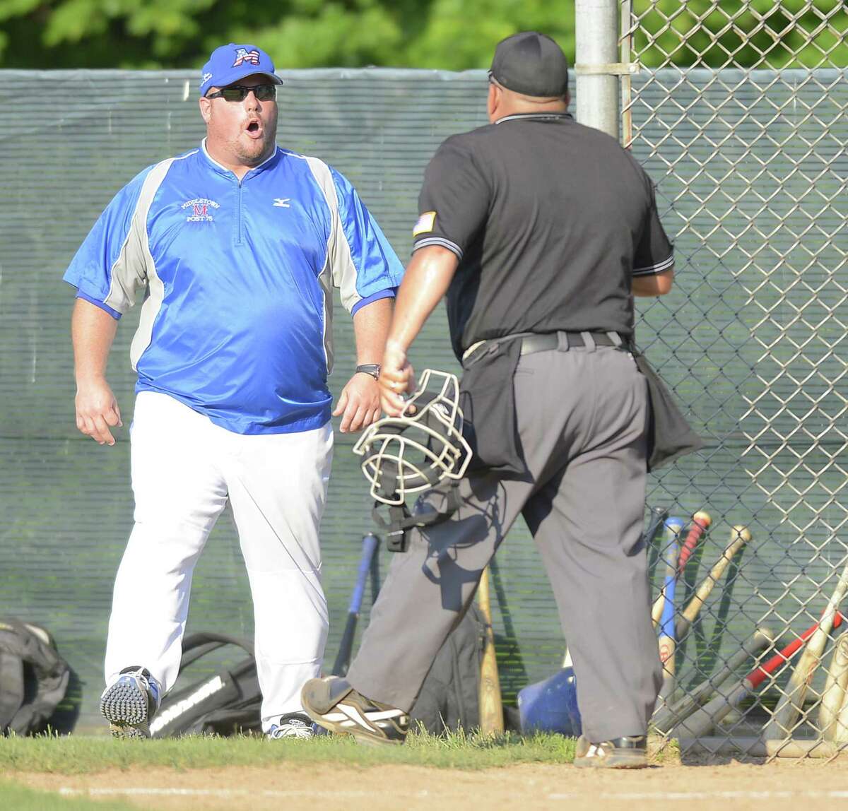 In this photo from last year’s state tournament, Middletown coach Tim D’Aquila argues with umpire Pete Stokes during a game against Greenwich.