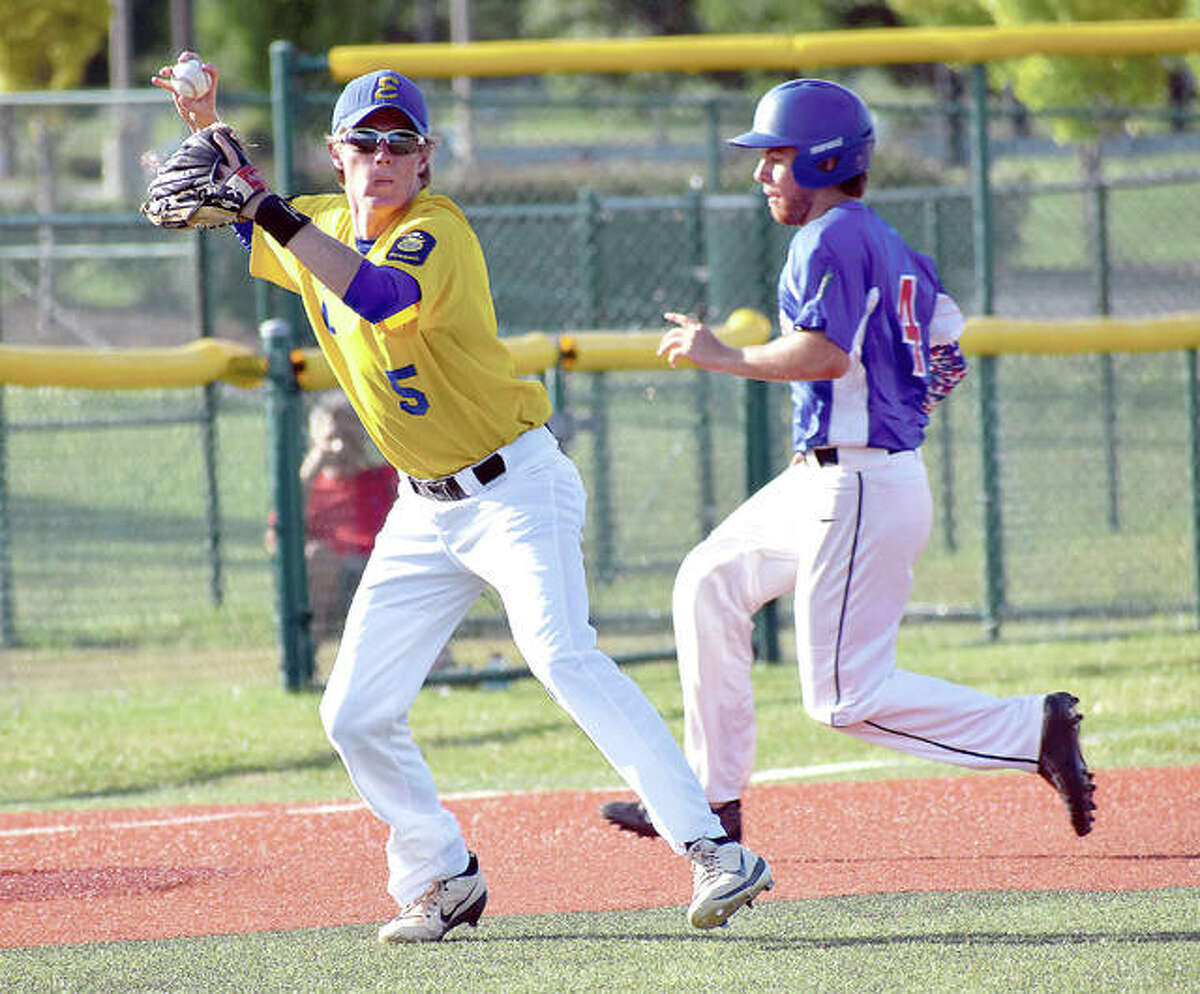 Post 199 third baseman Will Messer throws across the diamond to get the first out in the first inning against Belleville on Thursday at the EHS junior varsity field.