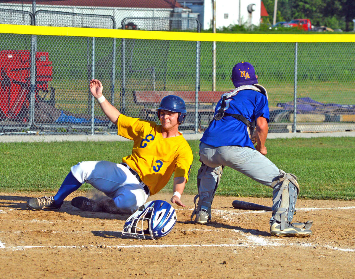 Post 199’s Joel Quirin scores on a single by Chase Gockel during the second inning of Friday's game at New Athens.