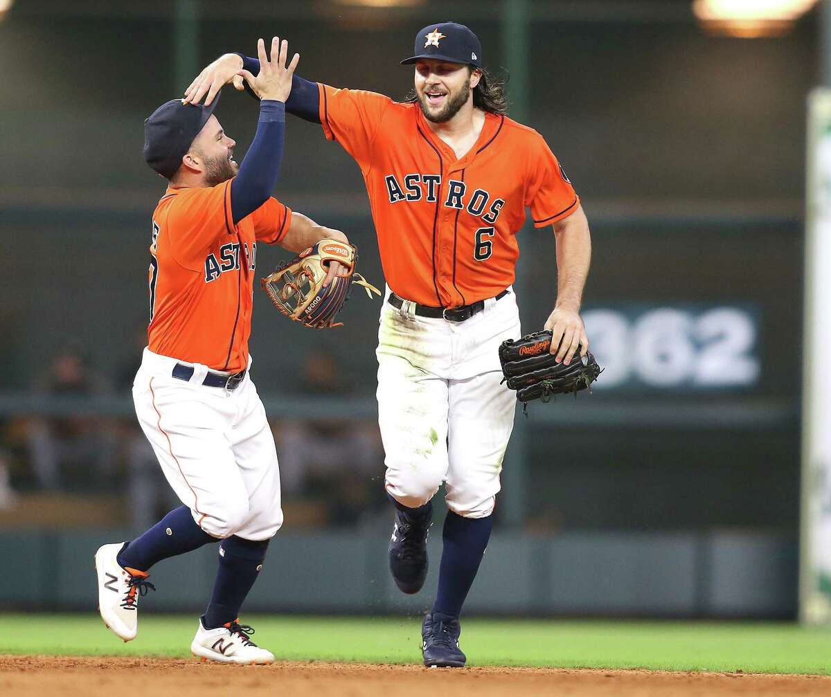 Houston Astros second baseman Jose Altuve (27) celebrates Houston Astros center fielder Jake Marisnick (6) catch in the top of the eighth inning against the Chicago White Sox at Minute Maid Park on Friday, July 6, 2018 in Houston. McCullers went over five innings without a hit.