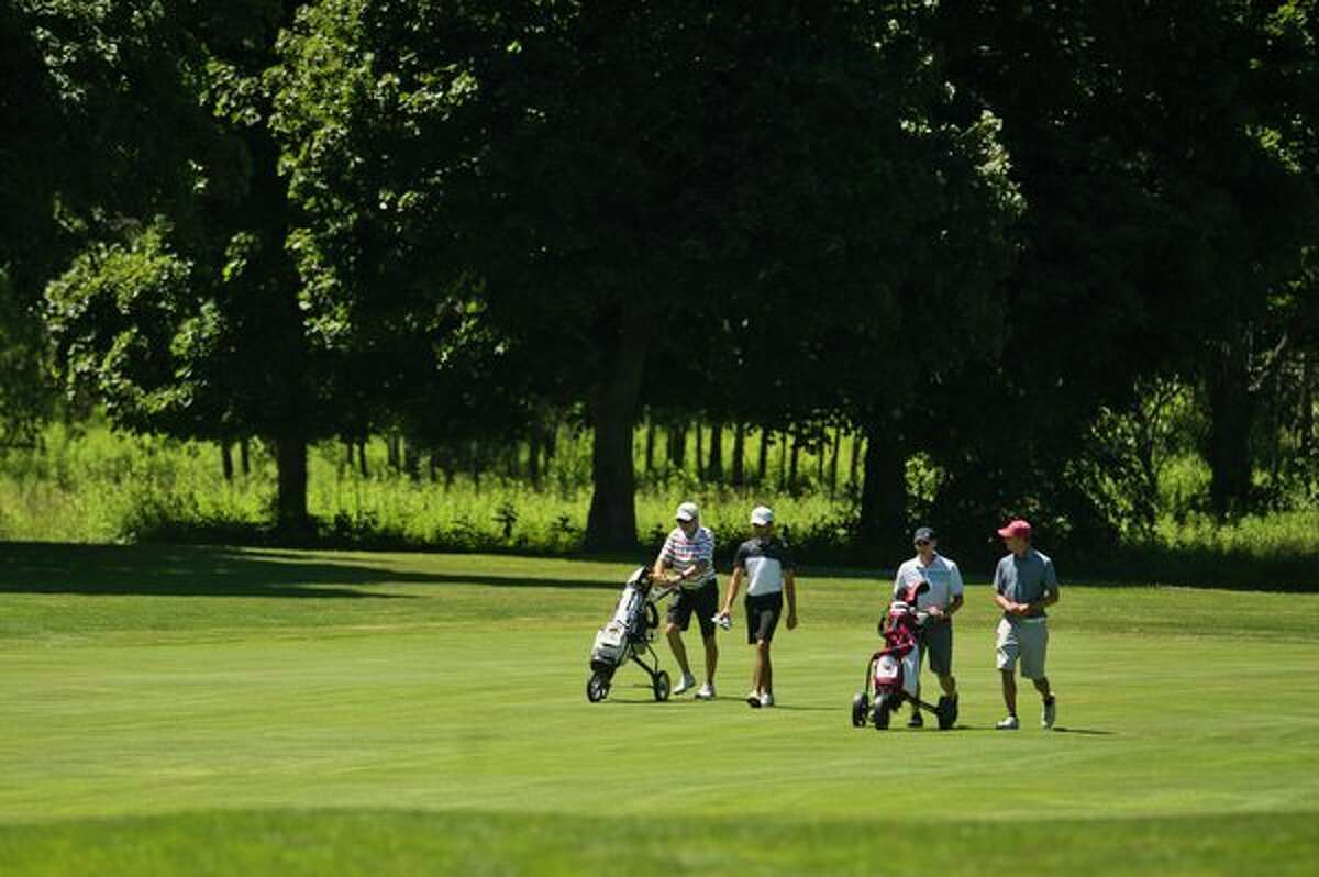 About 75 golfers compete in a qualifier for the U.S. Amateur on Friday at Currie Golf Course. (Katy Kildee/kkildee@mdn.net)