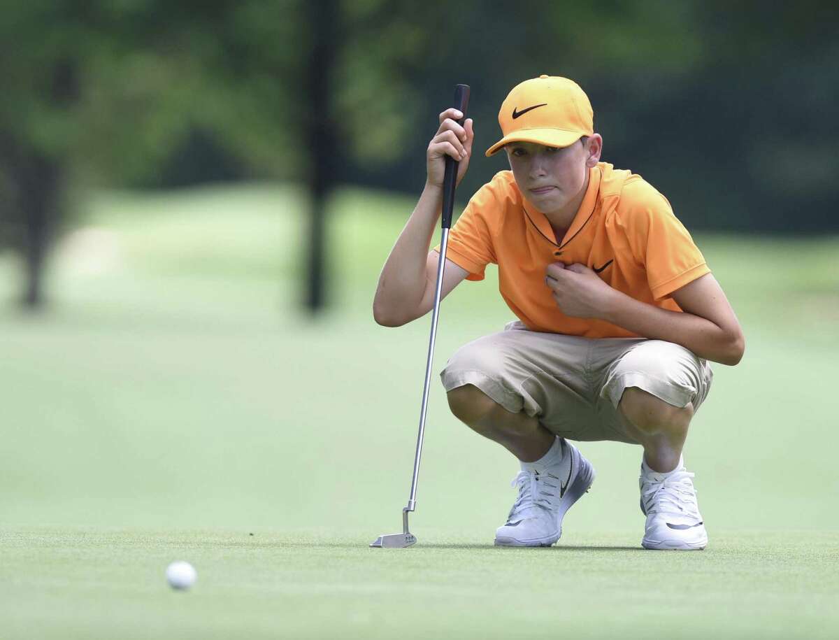 Ben James, 13, of Great River Golf Club in Milford, lines up a putt during the 2016 Connecticut Open.