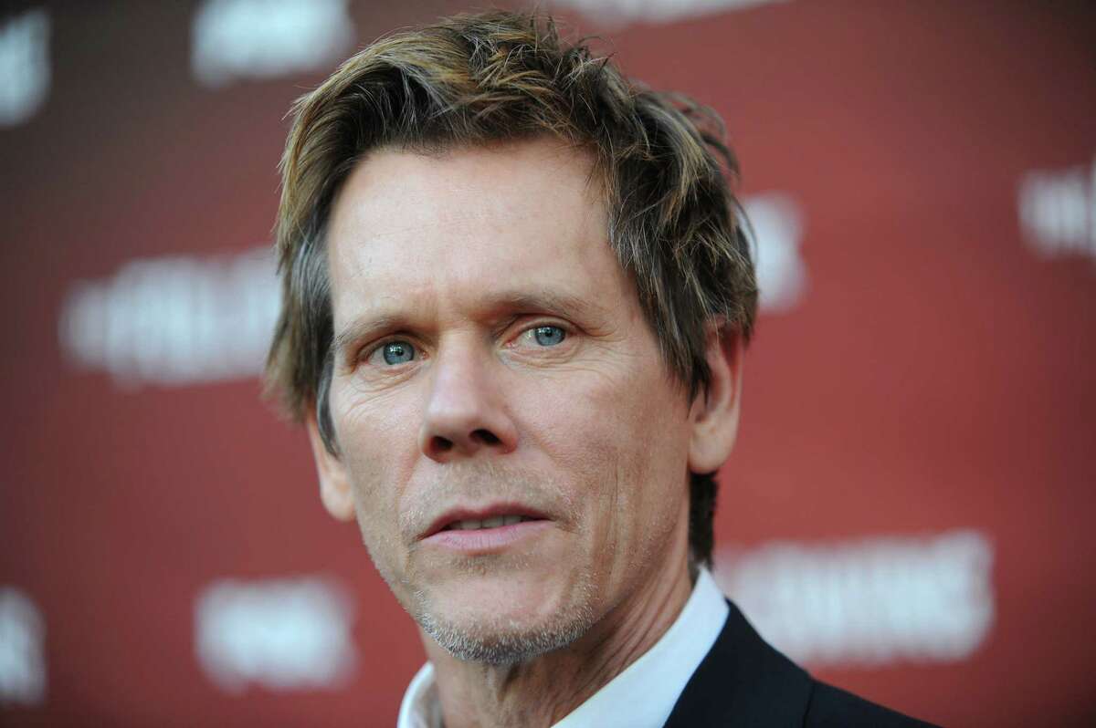 Kevin Bacon arrives at the Academy Screening and Q and A for "The Following" at the Leonard H. Goldenson Theatre on Monday, April 29, 2013 in North Hollywood, Calif. (Photo by Richard Shotwell/Invision/AP)