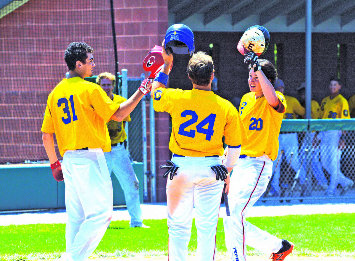 Post 199’s Cole Hampton, right, is congratulated by teammates Nick Yates, left, and Reid Hendrickson after hitting a three-run homer in the bottom of the fourth inning during Sunday’s game against Harrisburg at Alton High School.