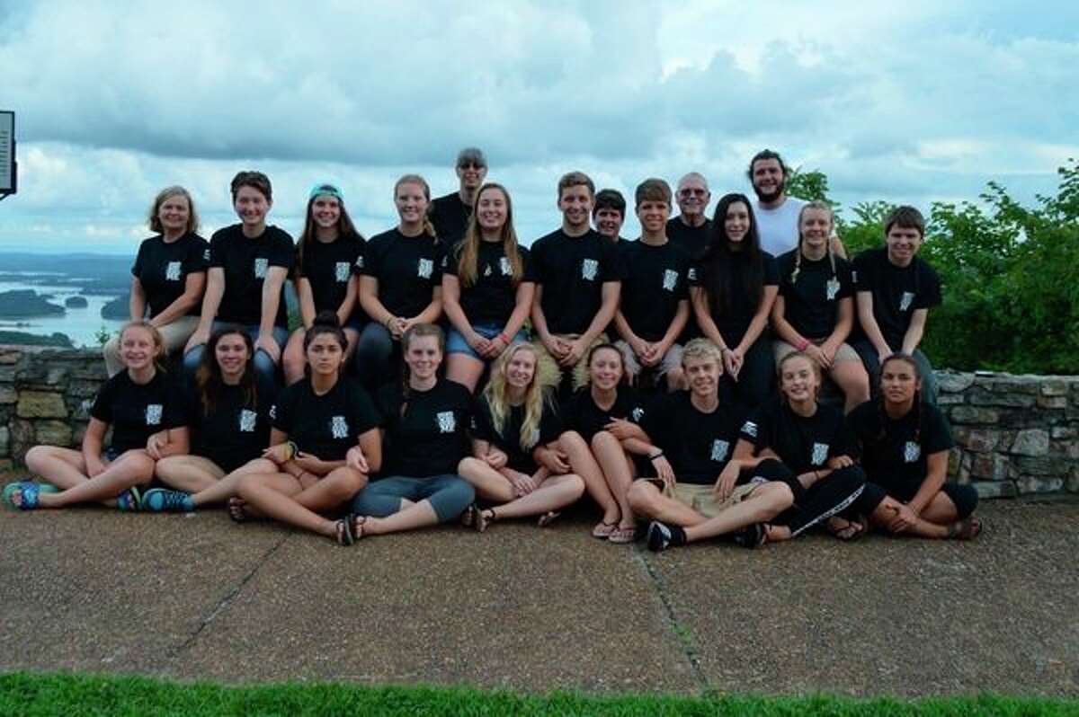 A group of teens from St. Agnes Catholic Church in Freeland poses prior to going on a missions trip to Tennessee in the recent past. Among them are Dow High standout swimmer Jacob Krzciok (bottom row, third from right) and Freeland standout soccer player and track runner Mary Hemgesberg (top row, second from right), both of whom are preparing to take a missions trip to Lukulu, Zambia, Africa later this month to help some of the poorest people in the world. (photo provided)