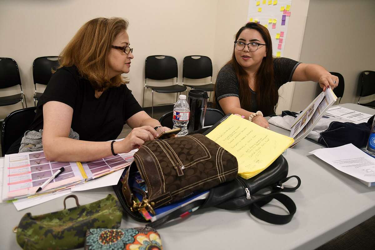 Jane Woodruff, from left, and Itzel Castillo, both from Houston, review for an exam in their Sterile Processing class as part of the Northwest Assistance Ministries workforce training held in The Harrell Family Opportunity Center on July 7, 2018. (Jerry Baker/For the Chronicle)