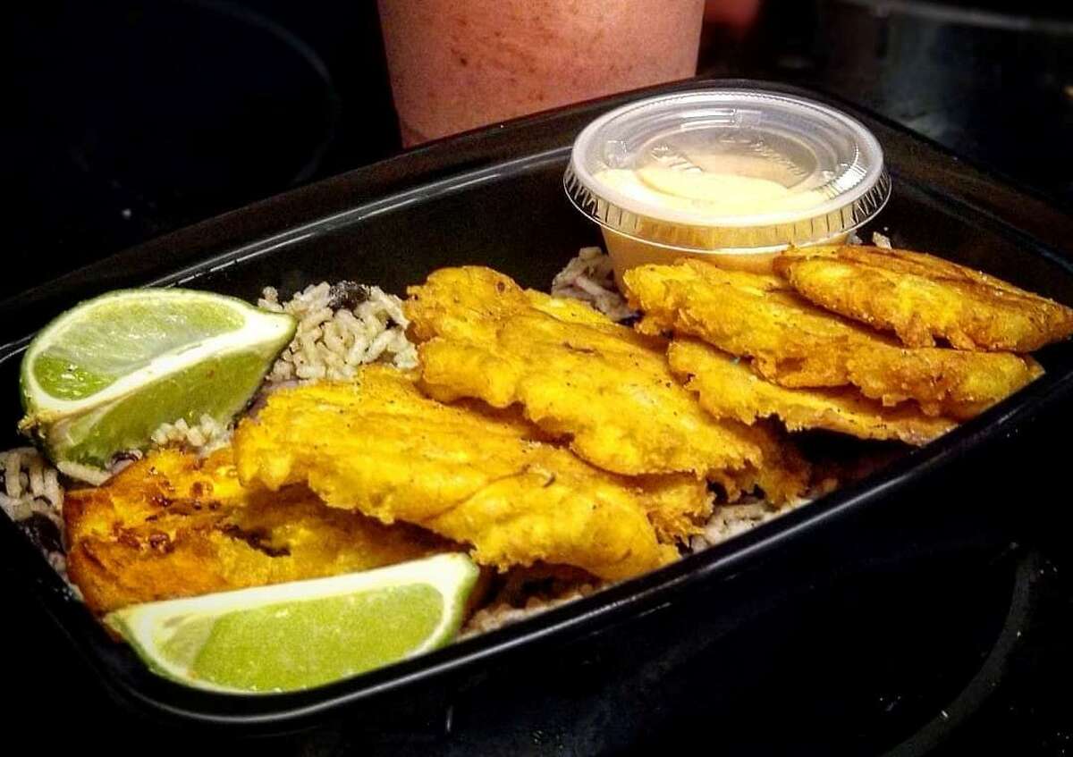 A plate of fried tostones (plantains) over a bed of rice from Go Vegan San Antonio. The Go Vegan San Antonio food truck will open July 10 at the Blanco Farmer's Market from 2-7 p.m. It will also be at The Rose Bush Food Truck Park (2301 San Pedro Ave.) on July 14 from 7-11 p.m.