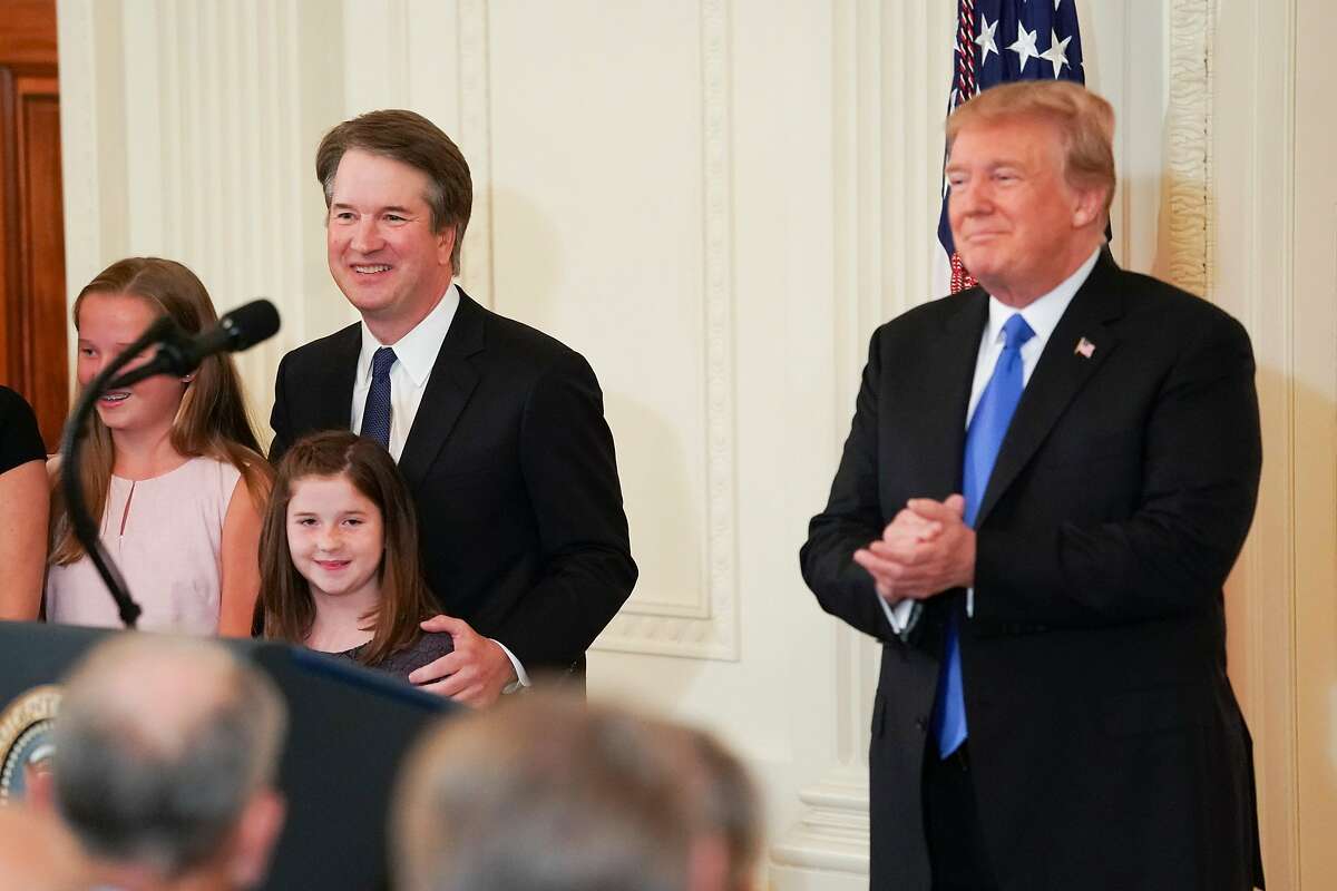 Judge Brett Kavanaugh, President Donald Trump's nominee for the Supreme Court, with his family and President Donald Trump at his announcement in the East Room of the White House in Washington, July 9, 2018. (Doug Mills/The New York Times)