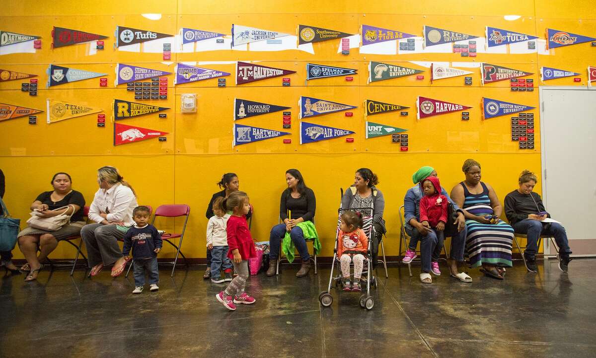 In this 2015 file photo, parents wait to sign up for the KIPP charter school system lottery in Houston. (Cody Duty / Houston Chronicle)