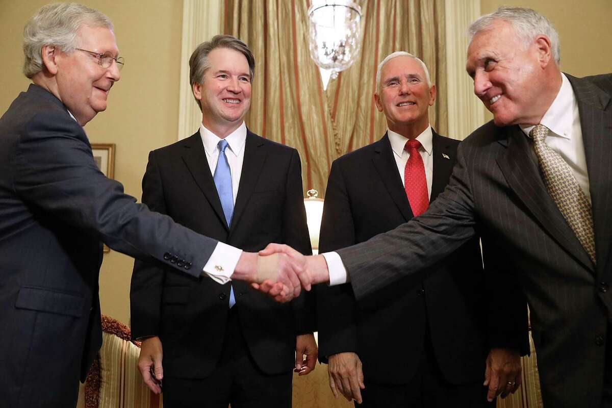 Senate Majority Leader Mitch McConnell, a Republican from Kentucky, left, shakes hands with former Senator Jon Kyl, a Republican from Arizona, during a meeting with Brett Kavanaugh, U.S. Supreme Court associate justice nominee for U.S. President Donald Trump, second left, and U.S. Vice President Mike Pence at the U.S. Capitol in Washington, D.C., U.S., on Tuesday, July 10, 2018. Senate Republicans are pledging a swift confirmation process that would put Kavanaugh on the bench before the new term opens Oct. 1, and there is little Democrats can do to stop them.