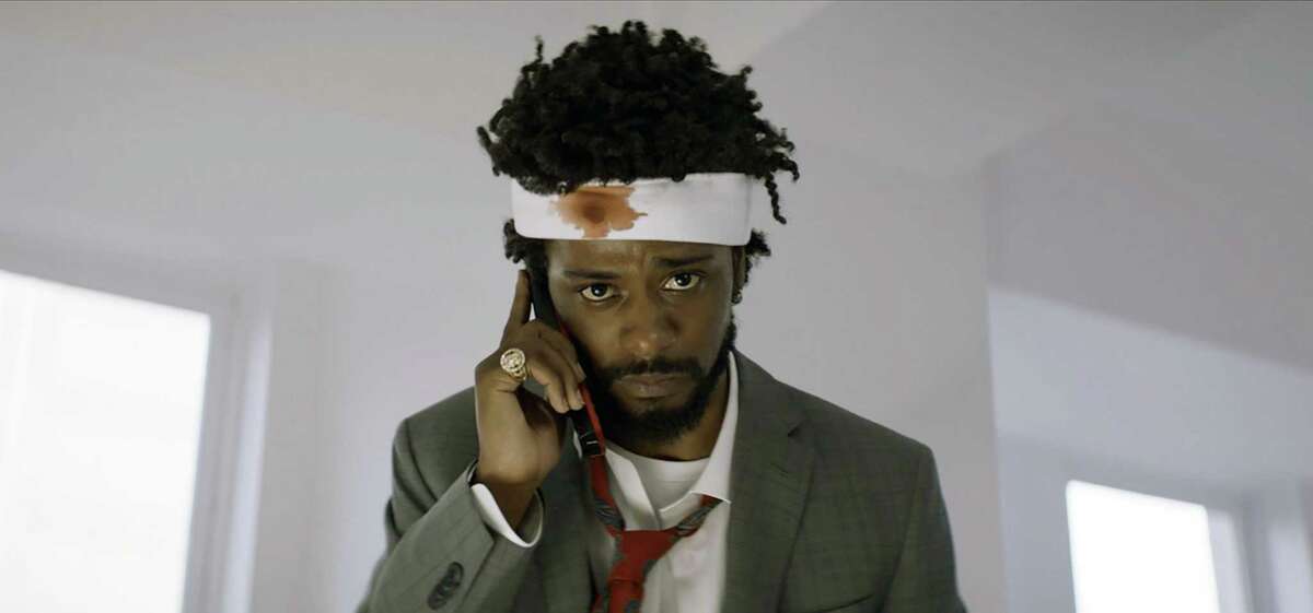 “Sorry to Bother You,” a sleeper hit, may be the most overtly anti-capitalist feature film made in America, says New York Times columnist Michelle Goldberg. This image released by Annapurna Pictures shows Lakeith Stanfield as Cassius Green in a scene from the film, "Sorry To Bother You." (Annapurna Pictures via AP)