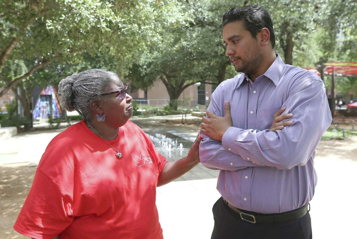 Valerie Harris, left, talks with Mitesh Patel on July 10, 2018 in Main Plaza. Harris is the aunt of condemned killer Christopher Anthony Young, who is scheduled to be executed July 17 for the 2004 murder of Mitesh Patel's father, Hasmukh “Hash” Patel.