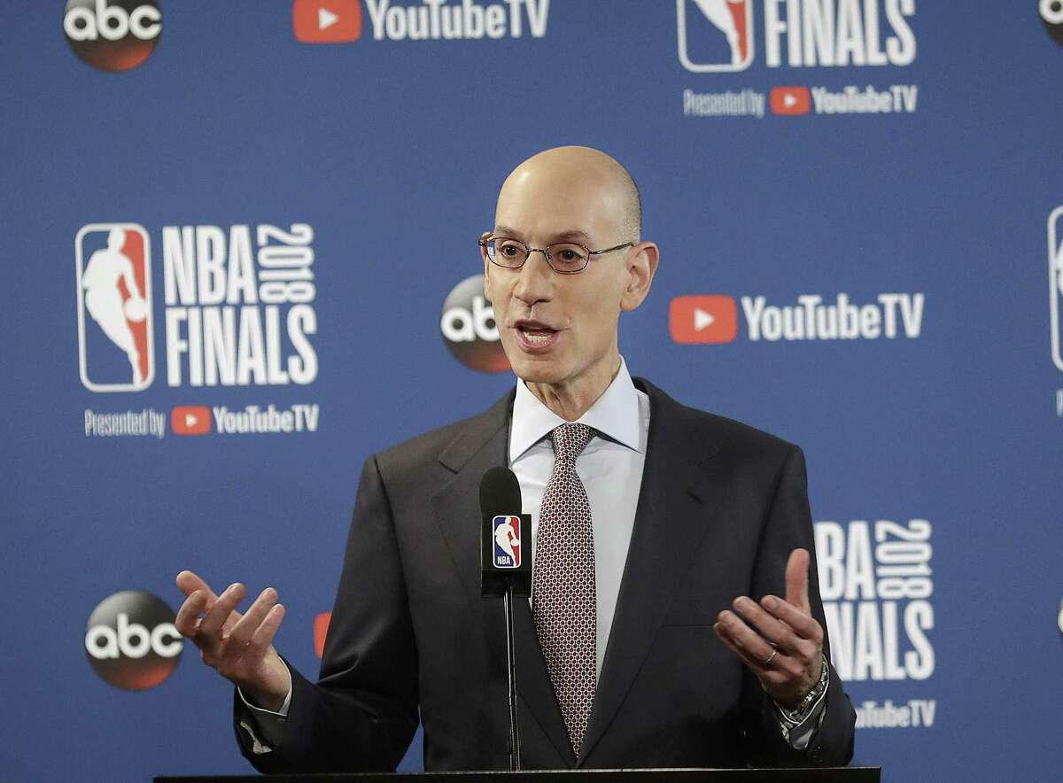 FILE - In this May 31, 2018, file photo, NBA Commissioner Adam Silver speaks at a news conference before Game 1 of basketball's NBA Finals between the Golden State Warriors and the Cleveland Cavaliers, in Oakland, Calif. A diversity report released shows the NBA continues to lead the way in men's professional sports in racial and gender hiring practices. The league earned an A+ for racial hiring practices and a B for gender hiring practices for an overall grade of an A. (AP Photo/Jeff Chiu, File)
