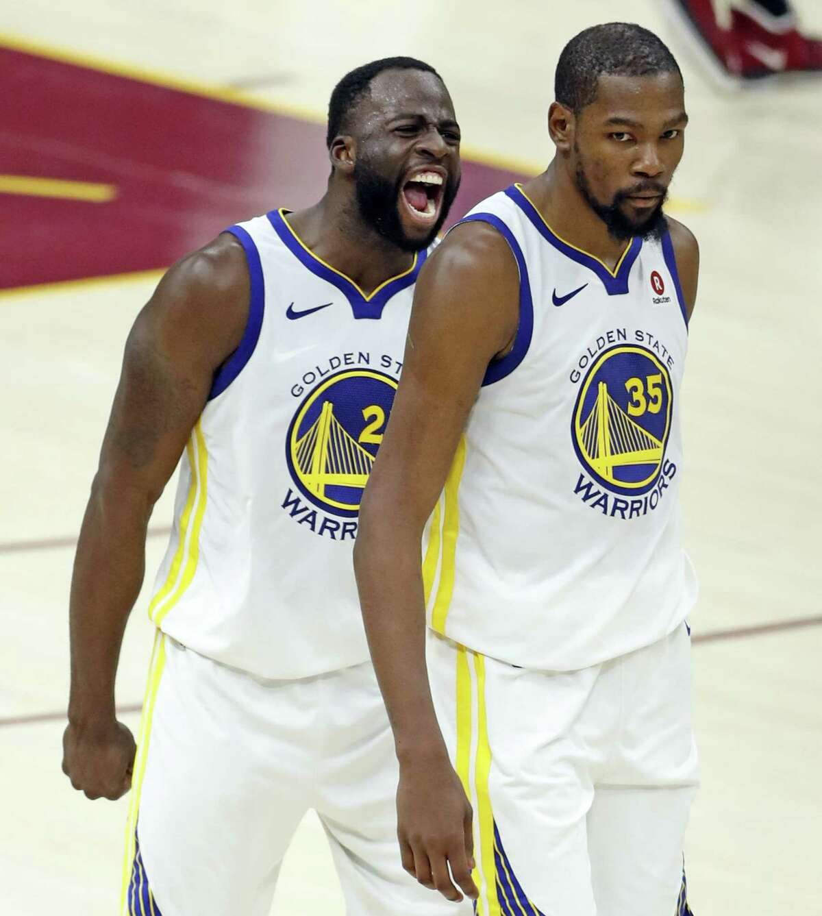 Golden State Warriors' Draymond Green exults after Kevin Durant hit a 3-pointer late in 4th quarter of Warriors' 110-102 win over Cleveland Cavaliers during Game 3 of the NBA Finals at Quicken Loans Arena in Cleveland, Ohio on Wednesday, June 6, 2018.