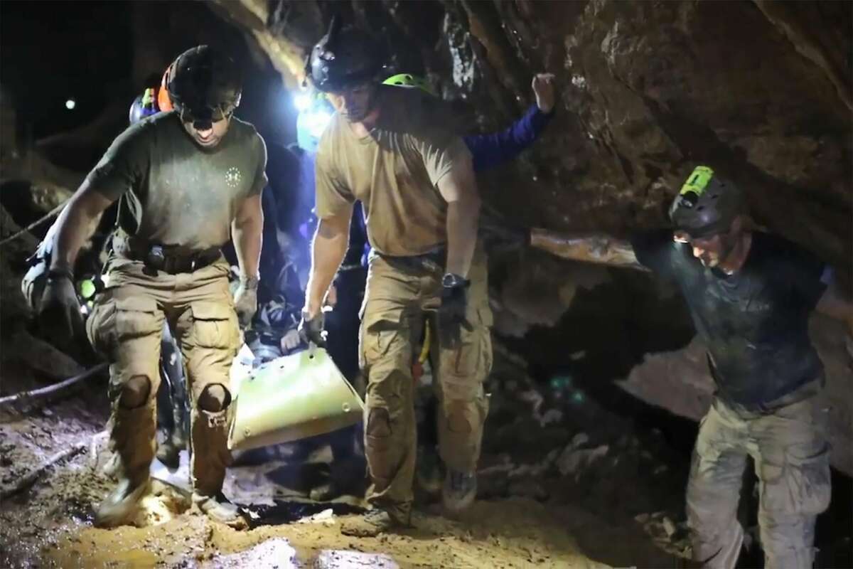 This handout video grab taken from footage released by the Royal Thai Navy on July 11, 2018 shows rescue personnel carrying a member of the "Wild Boars" Thai youth football team on a stretcher during the rescue operation inside the Tham Luang cave in Khun Nam Nang Non Forest Park in Mae Sai district. The 12 boys rescued from a Thai cave were passed "sleeping" on stretchers through the treacherous passageways, a former Thai Navy SEAL told AFP on July 11, giving the first clear details of an astonishing rescue mission that has captivated the world. / AFP PHOTO / ROYAL THAI NAVY / Handout / RESTRICTED TO EDITORIAL USE - MANDATORY CREDIT "AFP PHOTO / Royal Thai Navy " - NO MARKETING NO ADVERTISING CAMPAIGNS - DISTRIBUTED AS A SERVICE TO CLIENTSHANDOUT/AFP/Getty Images
